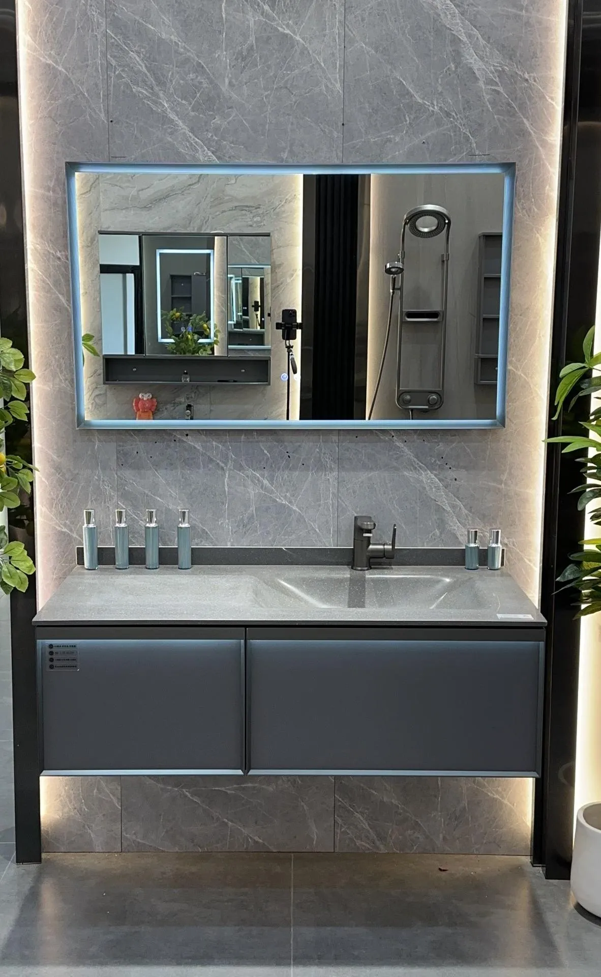 Terra 80 vanity: matte white one-piece sintered stone basin above a stone-grey wall-hung cabinet.