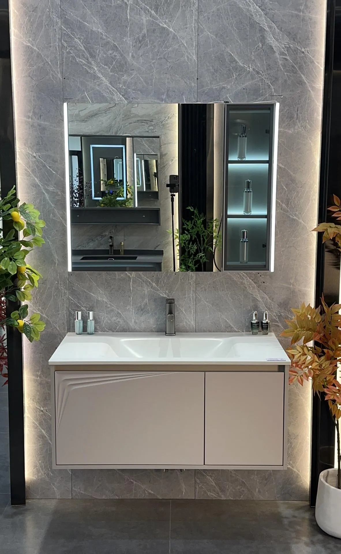 Lume 90 vanity: slim one-piece sintered stone basin with full-surround LED smart mirror above a wall-hung cabinet.